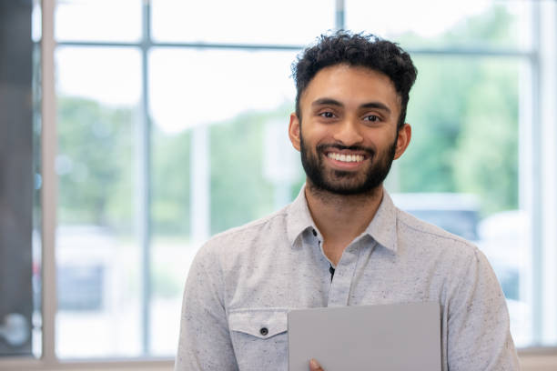 portrait of confident young professional smiling at camera