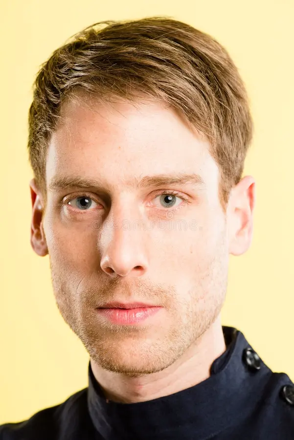 serious looking young man portrait 29765669